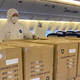 PPE being carried in the passenger cabin of an El Al airliner.